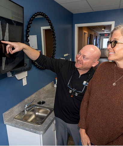 Dentist examining a patient&rsquo;s mouth during a dental check-up, highlighting the importance of oral health and dental care services at Sipes Dental in York, PA